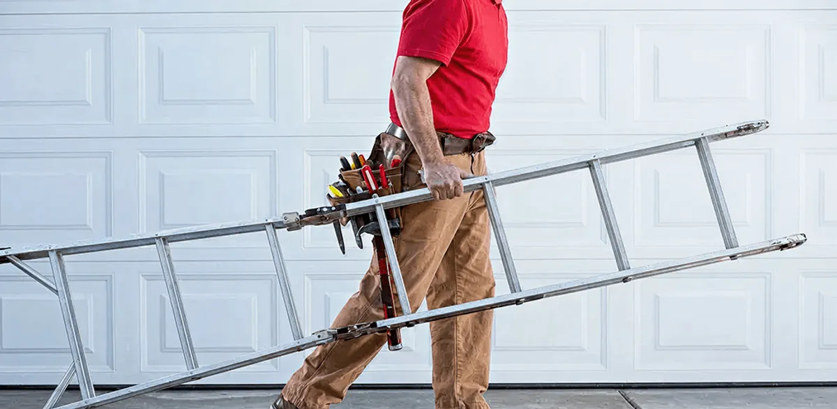 Garage door repair technician arriving with tools and ladder in Jacksonville, FL