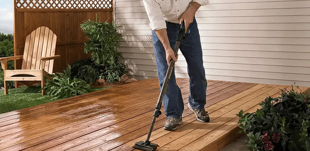 Deck staining service applying stain to a backyard wood deck in Jacksonville, FL